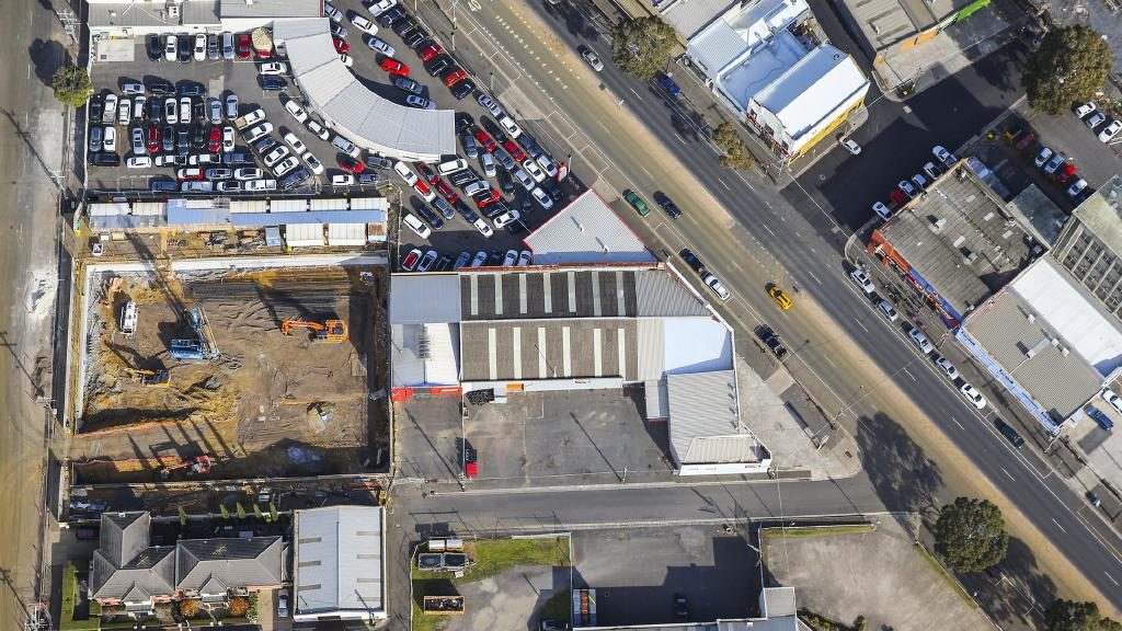 The property at 73-77 Mercer St, Geelong, is directly in front of the construction zone for Mirimar apartments.
