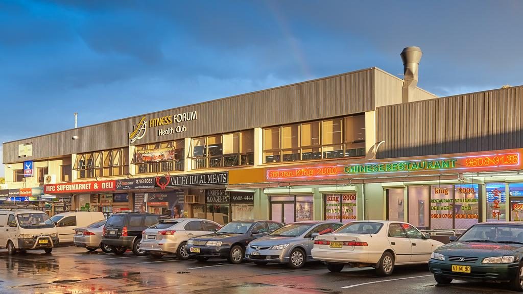 This busy shopping strip has changed hands after more than half a century.
