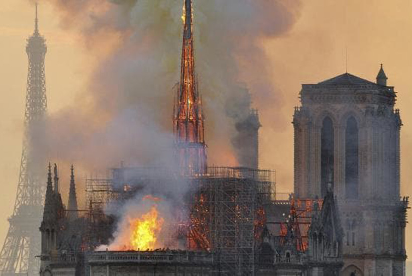 Flames and smoke rise from the blaze at Notre Dame Cathedral in Paris on April 15. Picture: AP
