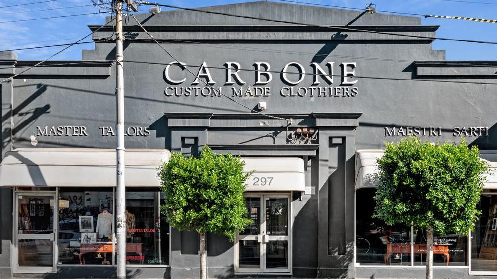 The Greek revival-style building is currently home to Carbone Master Tailors.
