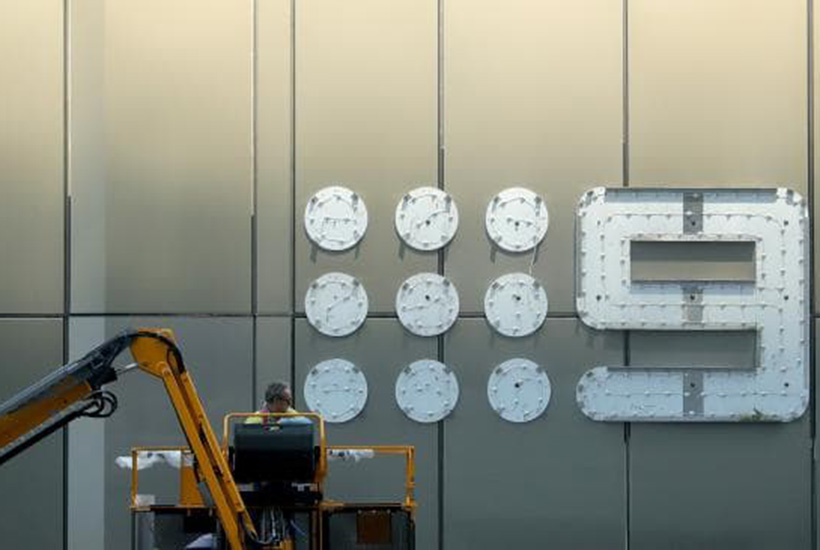 A worker carries out maintenance repairs on the Channel 9 office sign, in Melbourne’s Docklands. Stuart McEvoy/The Australian.
