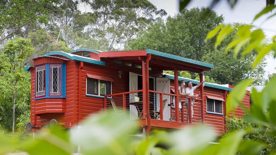 Restored Queensland train carriage, Glass House Mountains. Photo: Supplied by Glamping Hub
