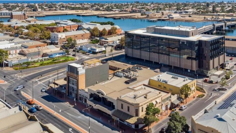 Pick up and run with half-finished Port Adelaide apartment block