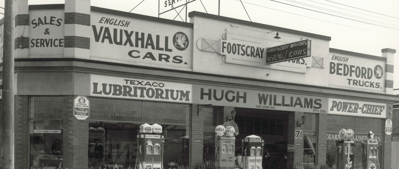 Footscray Motors circa 1930s. Note the multiple petrol brands at the one service station site. Picture: H.H. Paynting/ State Library of Victoria
