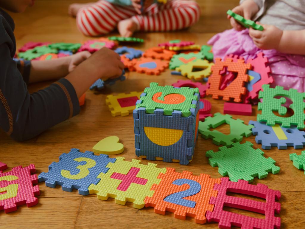 kids playing with puzzle, education concept