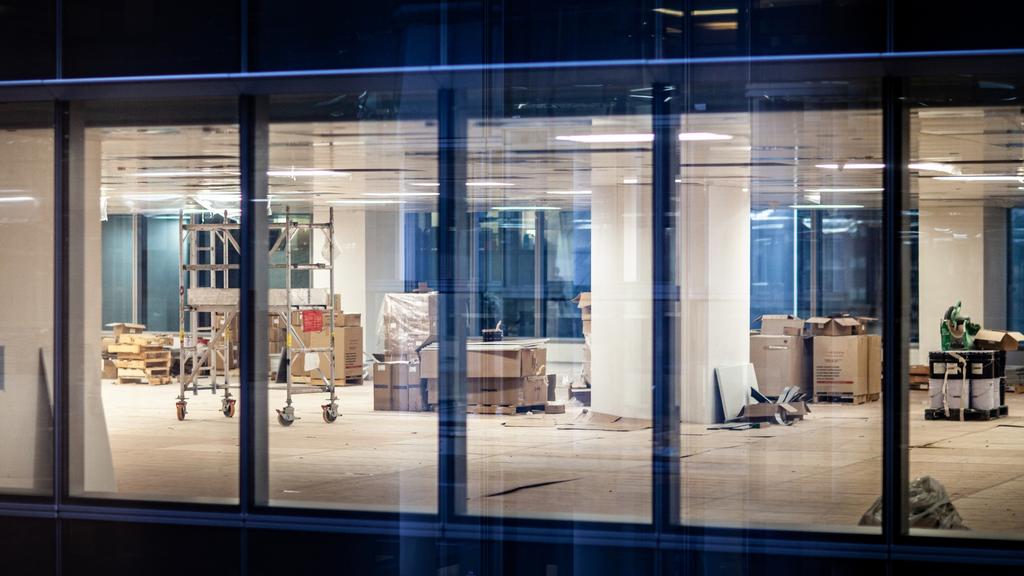 Construction renovation of new office in business building window at night