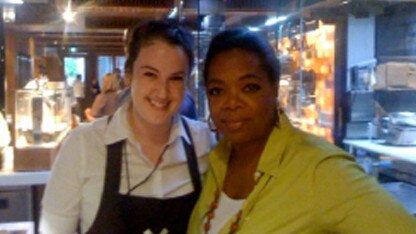 US TV host oprah Winfrey poses for a photo with store manager Erica Goldfinch at Victor Churchill's Butcher shop in Queens Street, Woollahra, Sydney.