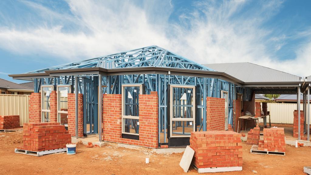 New residential construction home from brick with metal framing against a blue sky; real estate Australian generic suburban homes