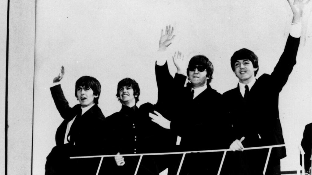 JUNE 1964 : Band The Beatles greet fans on their arrival in Sydney, Australia 06/64. Pic Courtesy of Glenn A Baker Archives. Beatles/Band