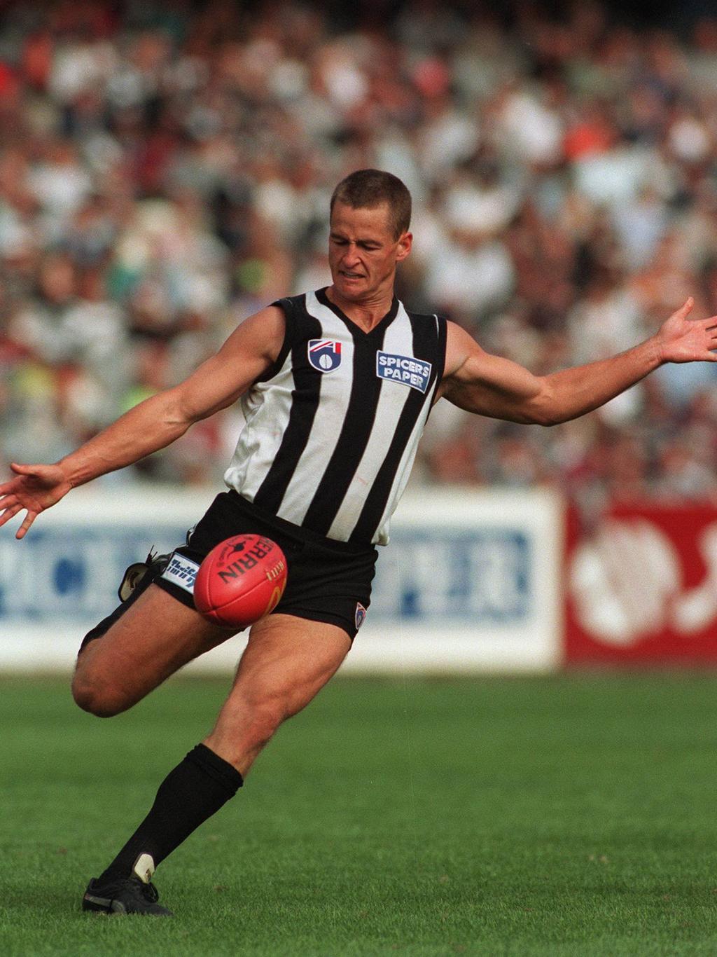 29/3/97. Collingwood v Port Adelaide. Scott Crow kicks the Magpies forward. a/ct
/football