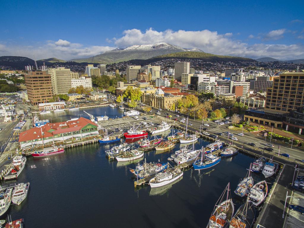 Boats docked on Hobart Waterfront in front of Mount Wellington